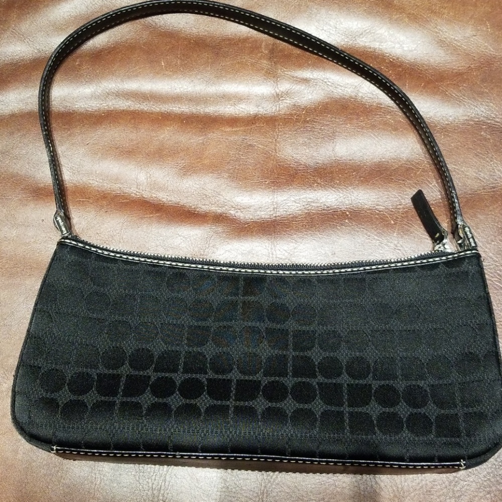 Kate Spade clutch in black dot jacquard canvas.